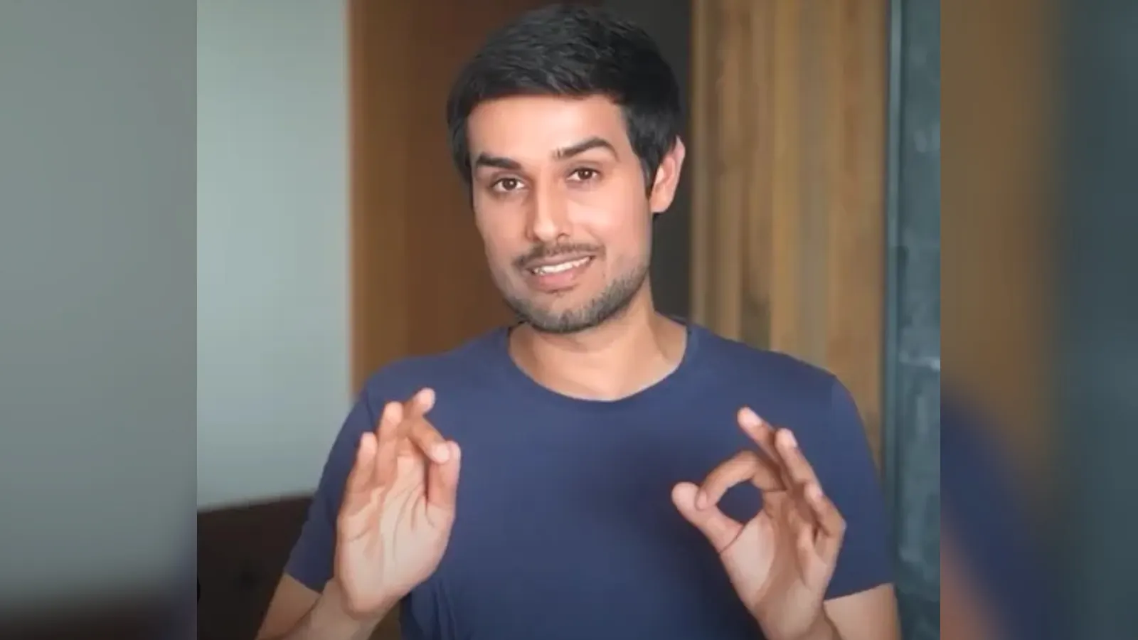 YouTuber Dhruv Rathee speaking at a press conference in Delhi as a court issues fresh summons in a 2018 defamation case linked to his BJP IT Cell video.