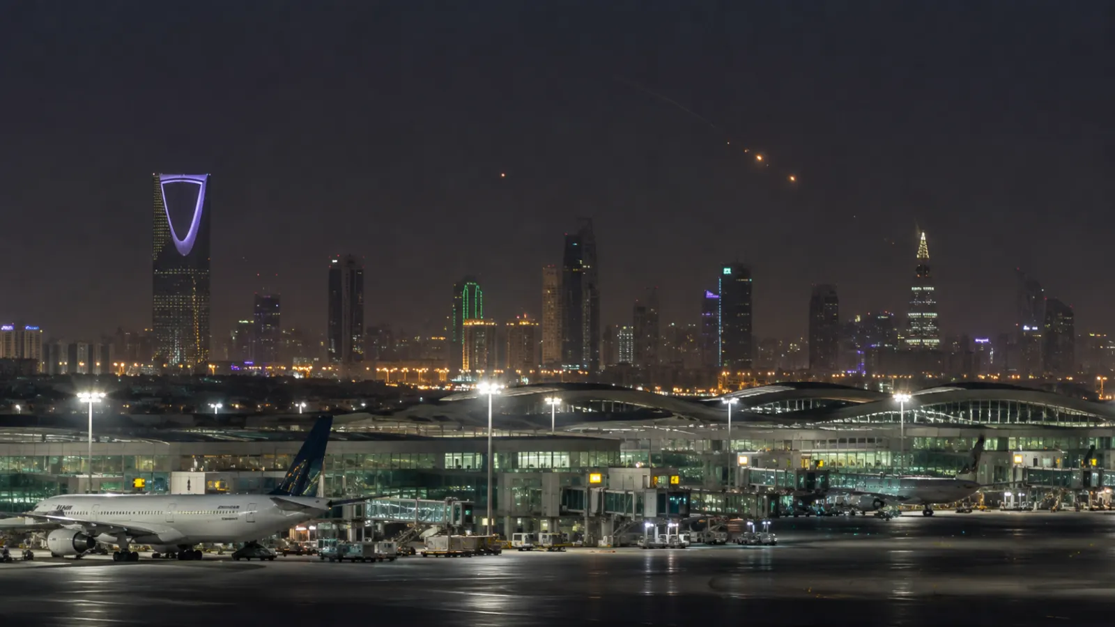 Riyadh airport at night as Saudi air defences respond to a reported Houthi missile and drone attack amid escalating Yemen conflict.