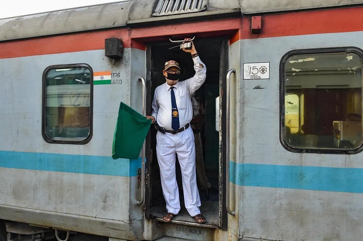 Indian Railways employees at a railway station as the government approves a 78-day productivity-linked bonus for eligible staff.