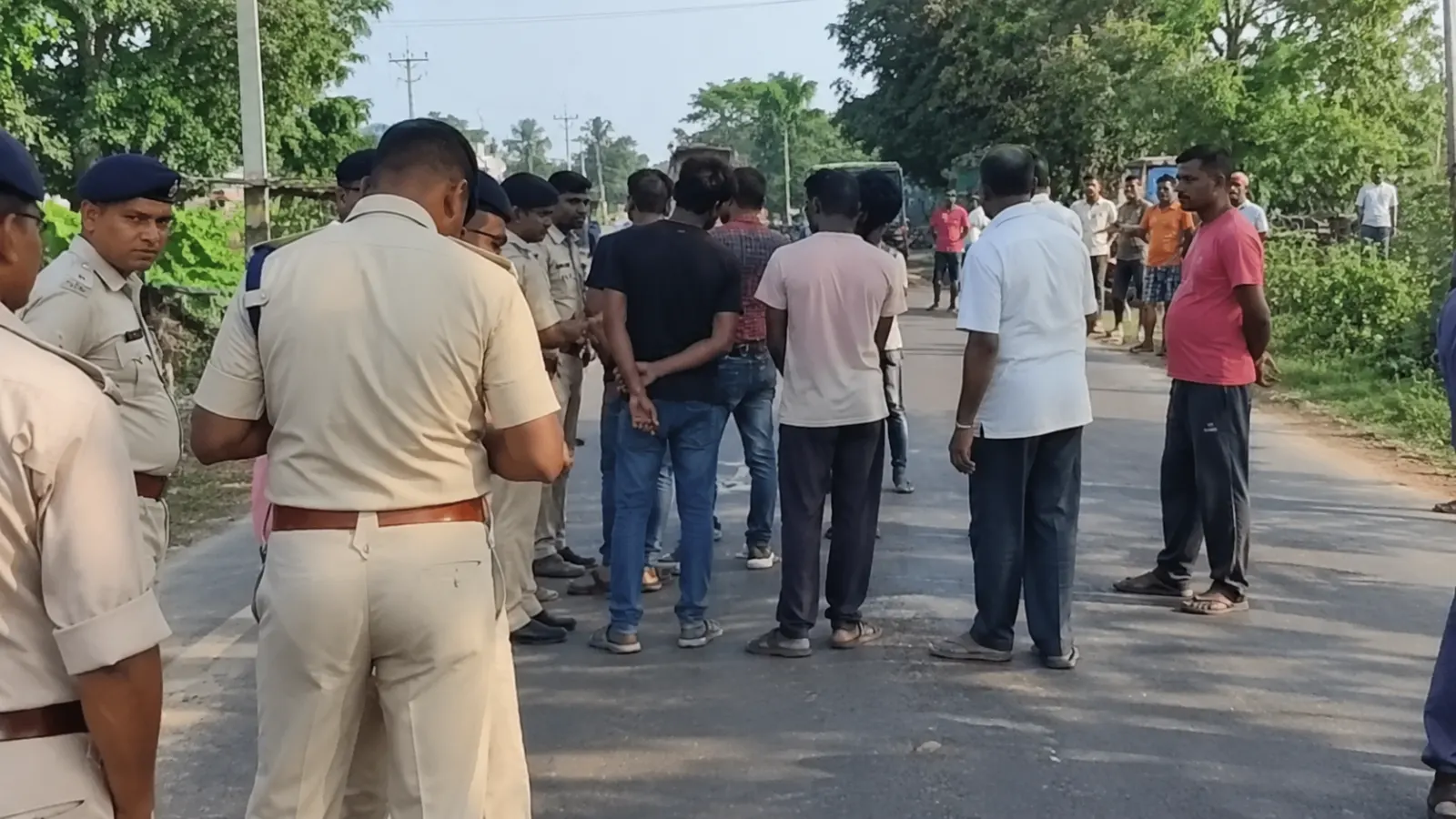 A roadside scene in Bihar with several people in the distance, illustrating the Samastipur harassment case and concerns over public safety.